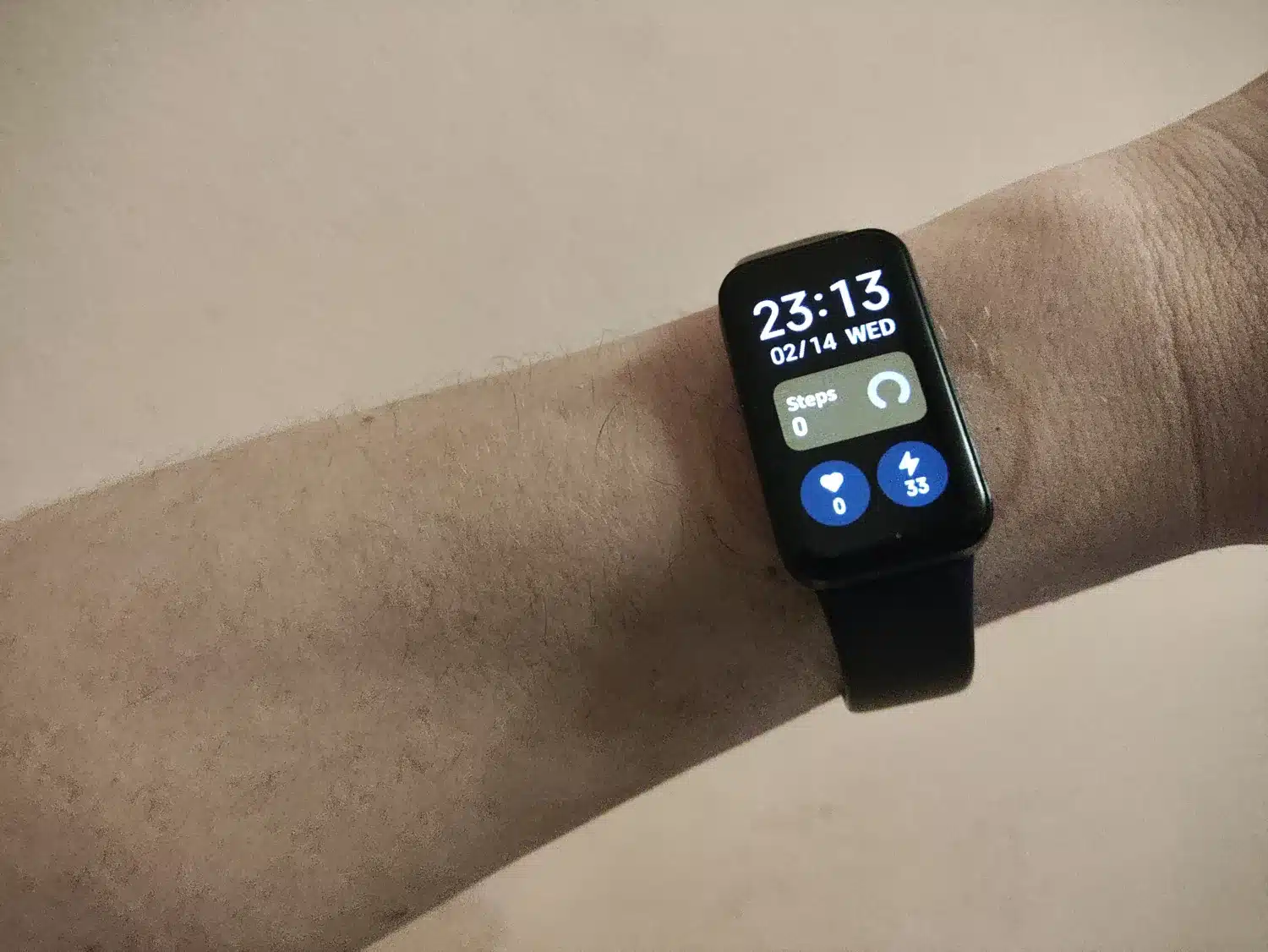 Xiaomi Redmi Smart Band Pro favorite watch face on it while on hand